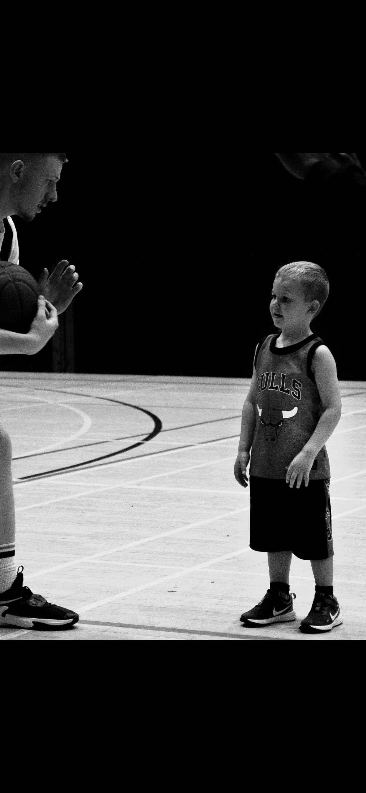Young player with coach